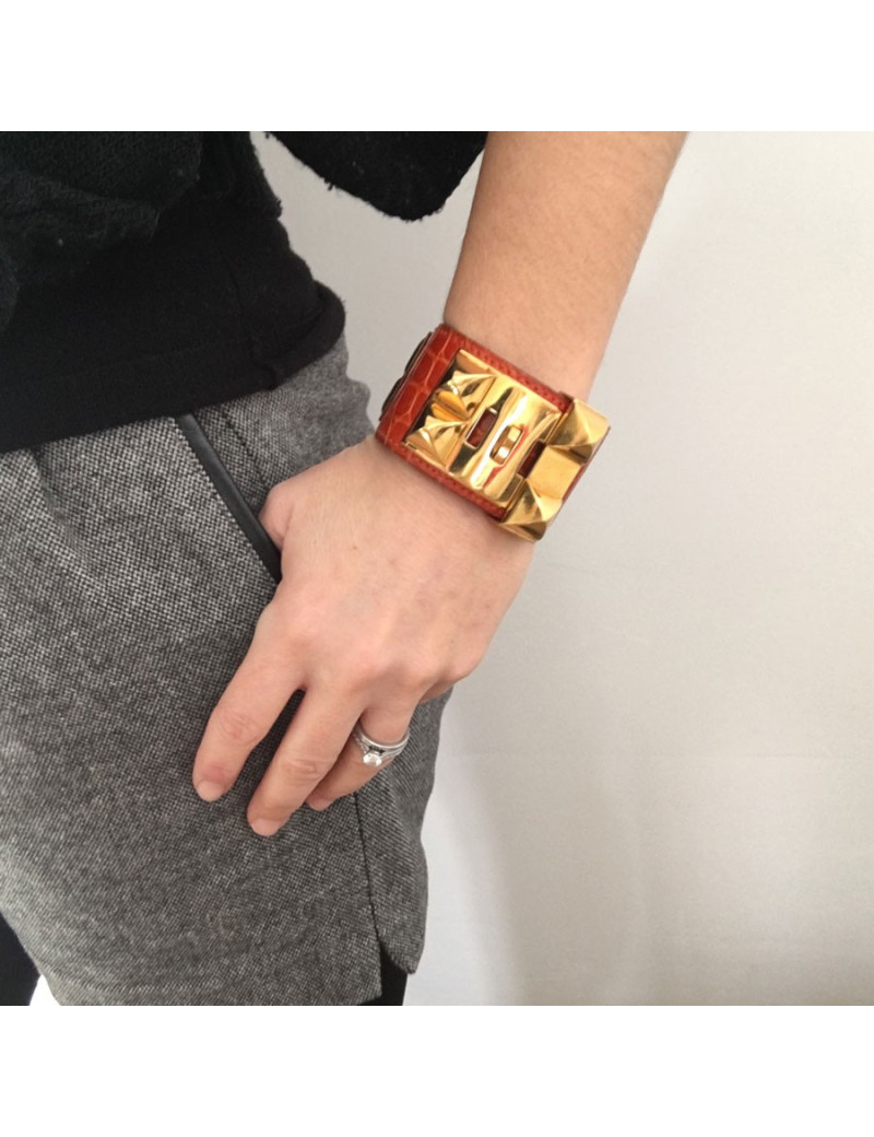 HERMES Medor cuff in orange leather and gold hardware