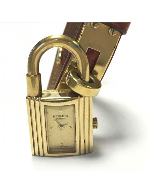 HERMES Kelly watch with ora,ge crocodile bracelet and gilded hardware