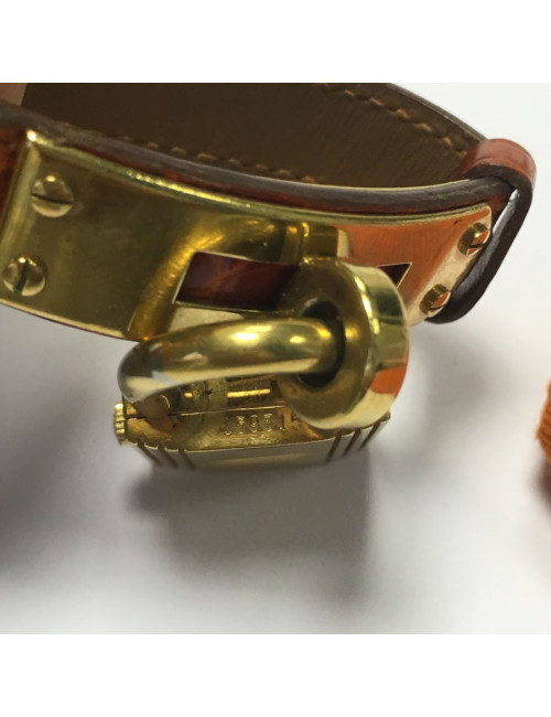 Montre HERMES Kelly pm en cuir crocodile orange et bijouterie dorée