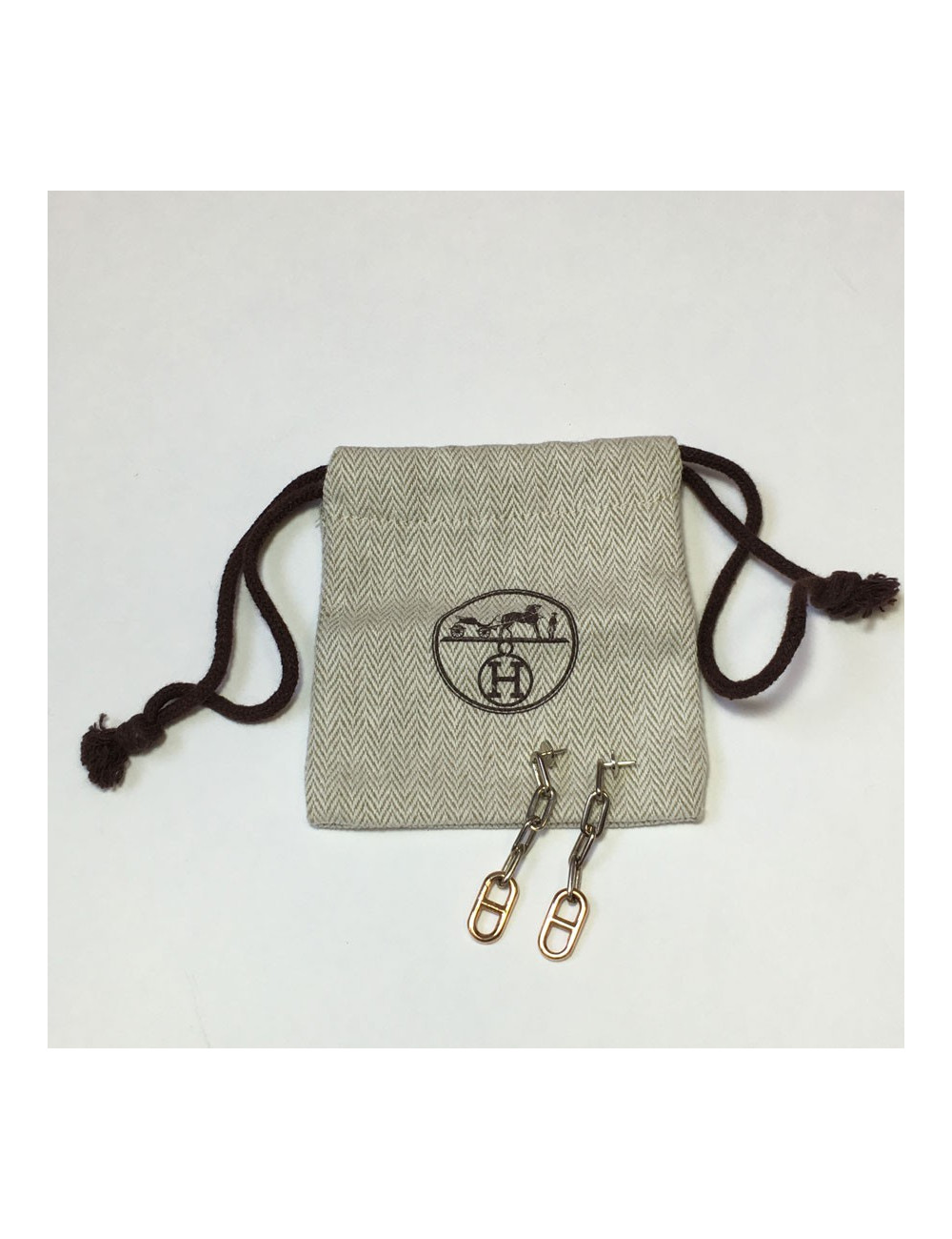 Boucles d'oreille clous HERMES pendants en or et argent