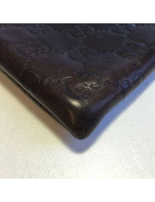 GUCCI monogram embossed brown leather pouch