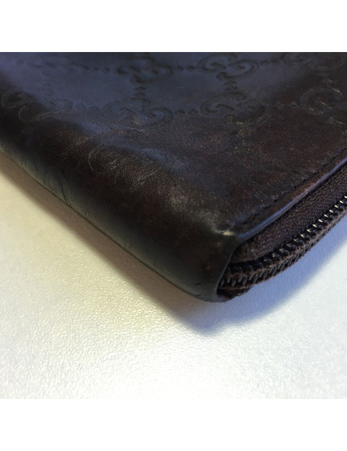 GUCCI monogram embossed brown leather pouch