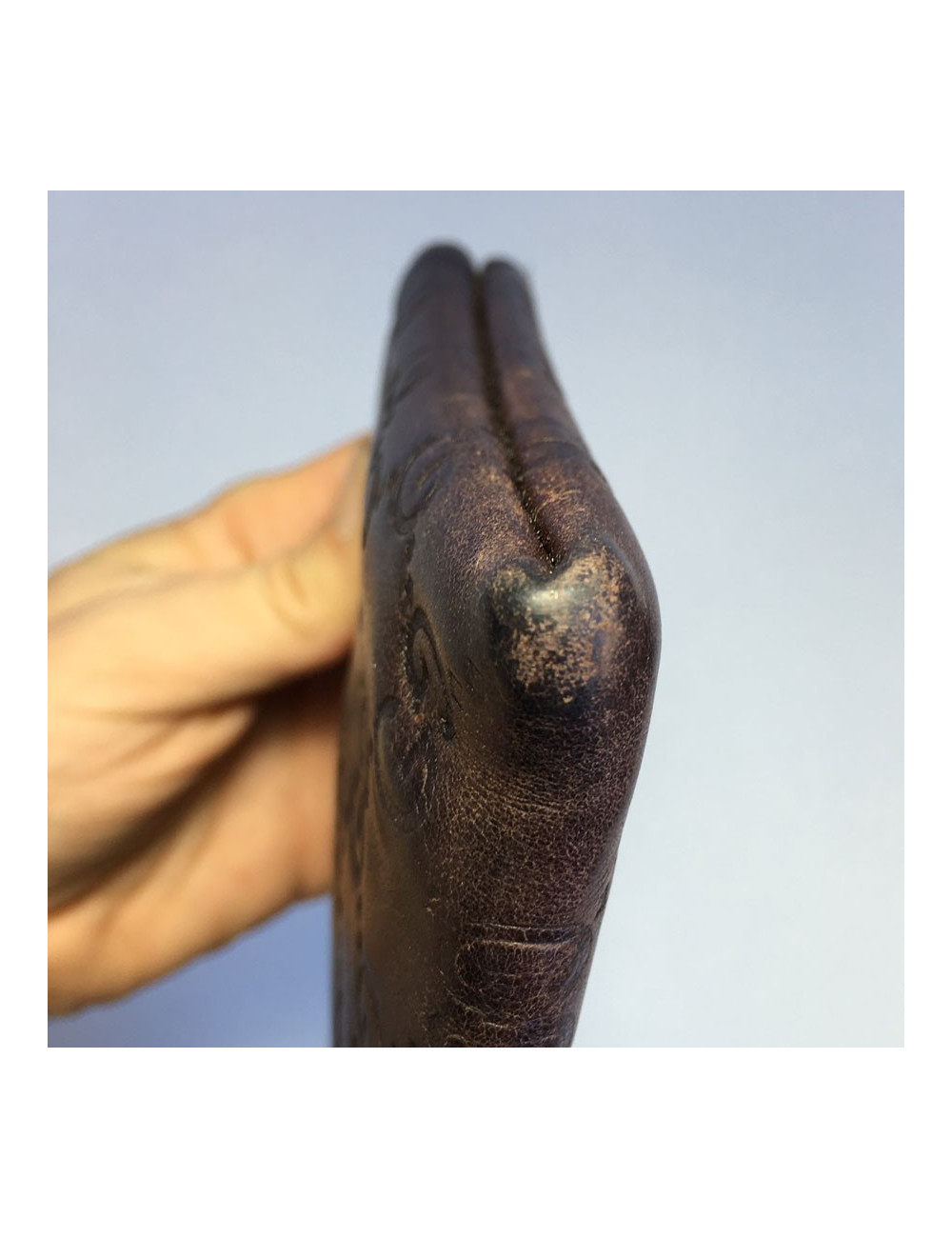 GUCCI monogram embossed brown leather pouch