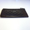 GUCCI monogram embossed brown leather pouch
