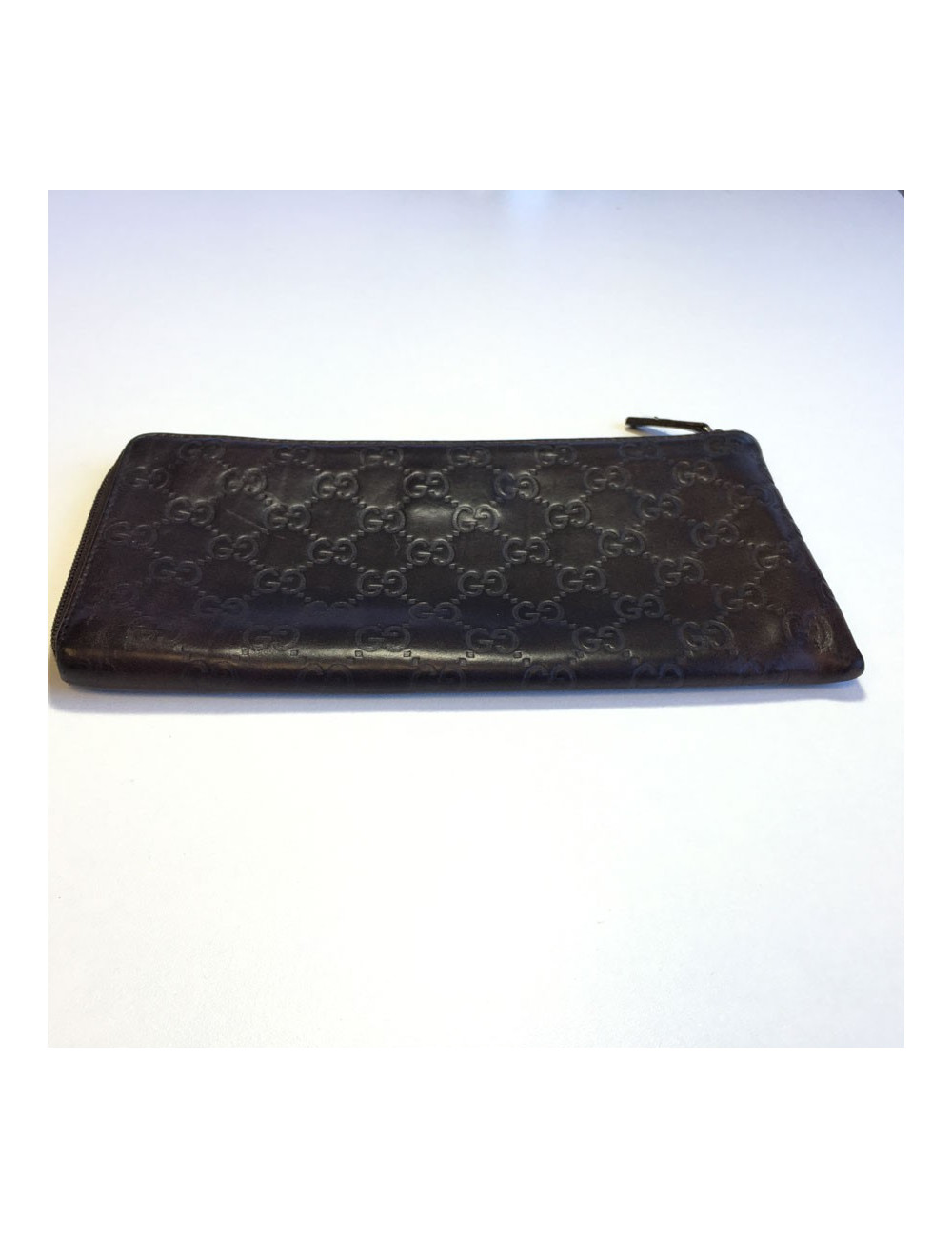 GUCCI monogram embossed brown leather pouch