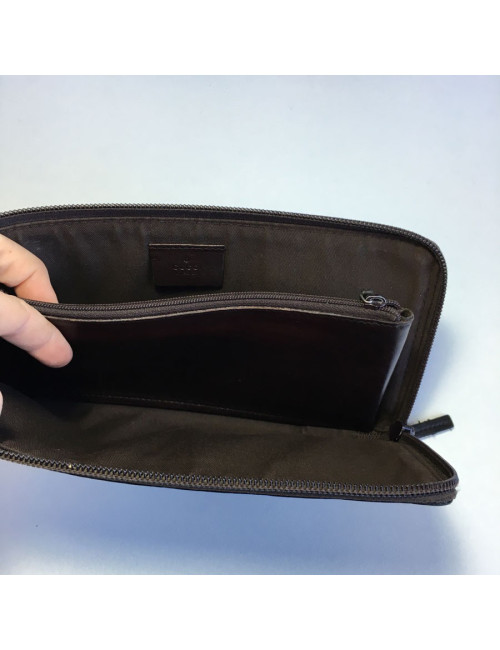 GUCCI monogram embossed brown leather pouch