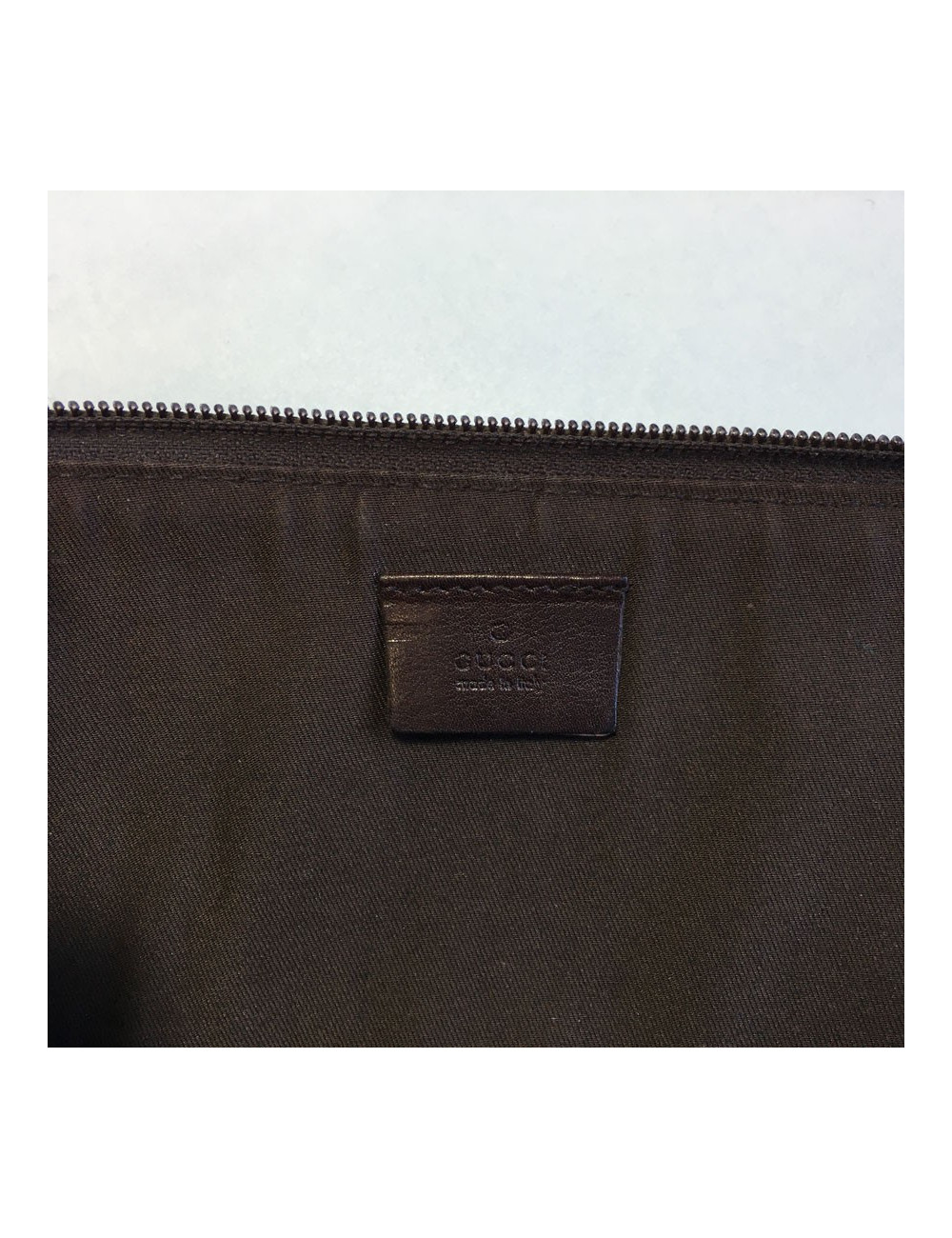 GUCCI monogram embossed brown leather pouch