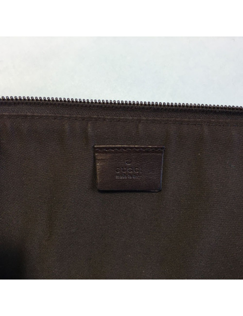 GUCCI monogram embossed brown leather pouch