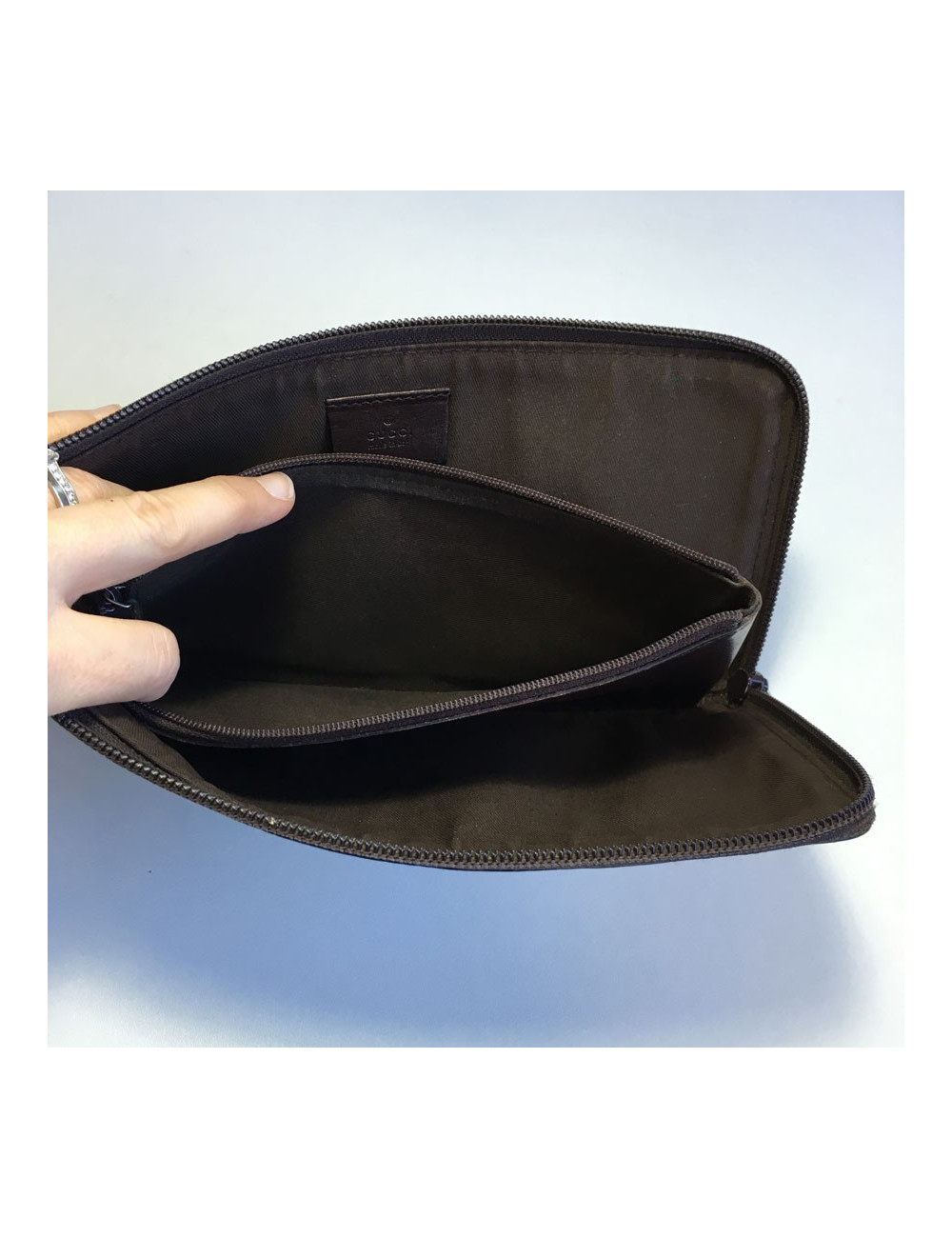 GUCCI monogram embossed brown leather pouch