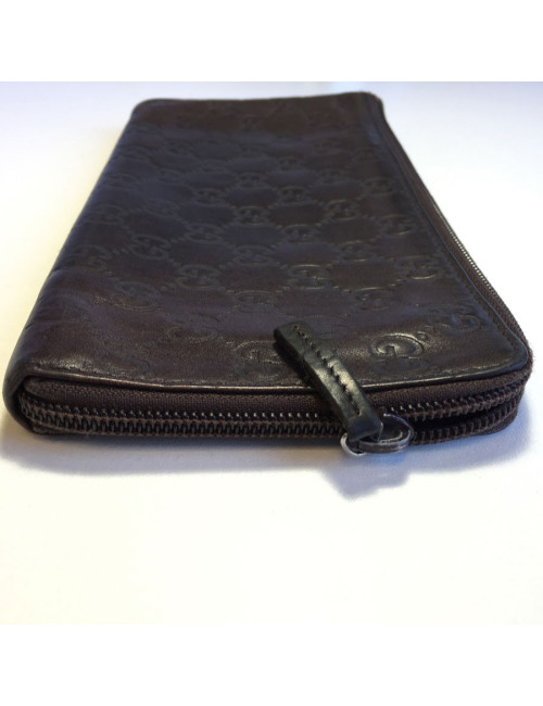 GUCCI monogram embossed brown leather pouch