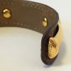 HERMES brown leather bracelet and gold bamboo