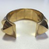 xxx Bracelet HERMES CDC en métal doré rigide