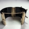 CHANEL "Paris-Dallas" cuff in black resin and jewellery gold metal
