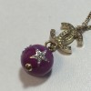 Gold metal, cc, round pendant necklace CHANEL purple and rhinestones