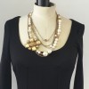 Collier CHANEL multiple rangs de perles, chaînes et pièce en métal doré