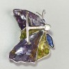 Broche LOUIS VUITTON papillon en pâte de verre multicolore et métal argenté