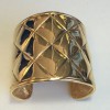 CHANEL Couture cuff bracelet with a quilted effect in gilded metal