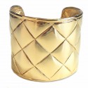 CHANEL Couture cuff bracelet with a quilted effect in gilded metal