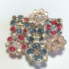 CHANEL brooch in multicolored resin, rhinestones and pearls