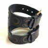 CHANEL "Coco" cuff bracelet in black leather