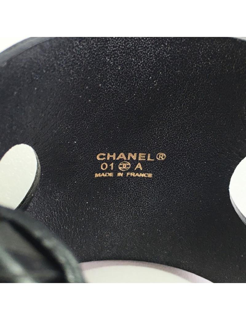 CHANEL "Coco" cuff bracelet in black leather