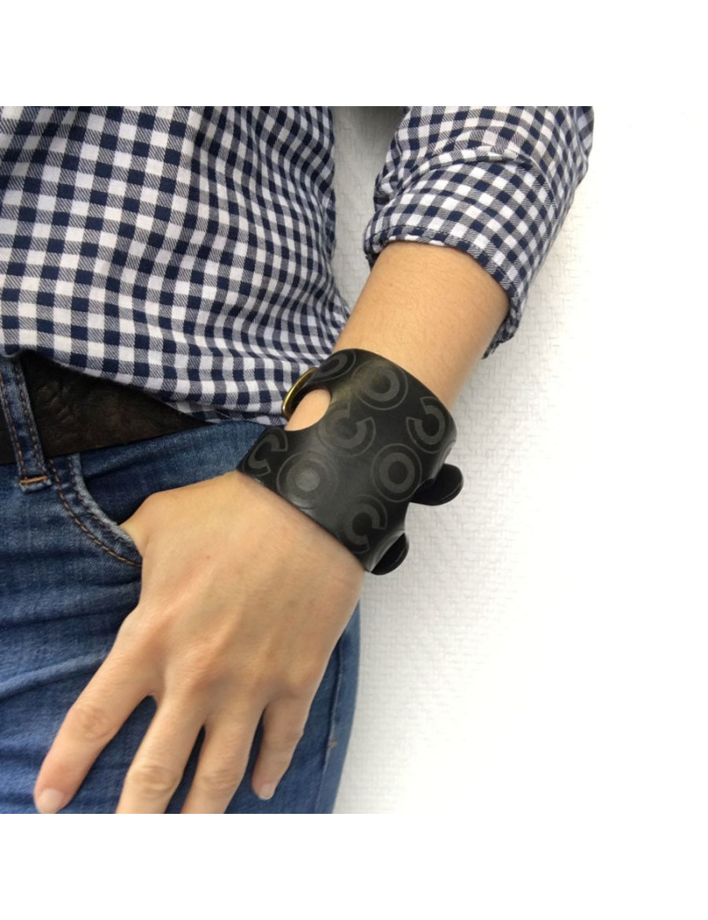 CHANEL "Coco" cuff bracelet in black leather