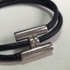 Bracelet Tournis HERMES lien en cuir noir et argent palladié