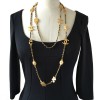 Symbols in gold metal and link black leather CHANEL necklace