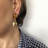 CHANEL clip-on earrings in gilded metal and amber resin