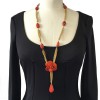 CHANEL couture necklace in gilded metal and camellia pendant in orange molten glass