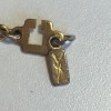 Porte-clés YVES SAINT LAURENT rond en métal doré