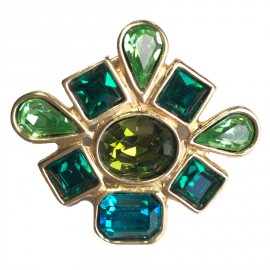Pin's YVES SAINT LAURENT in gold metal and green stones
