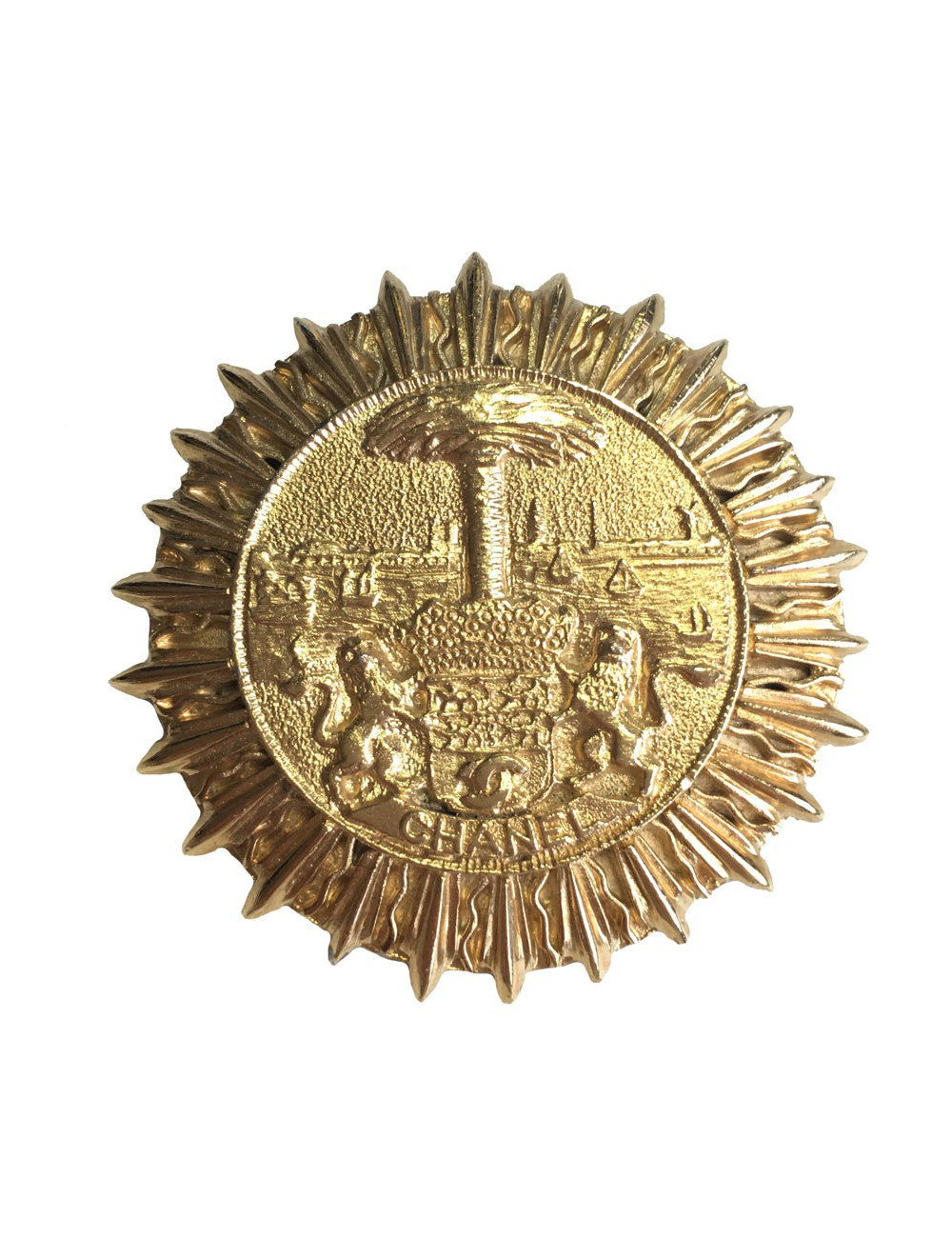Broche CHANEL ronde vintage en métal doré