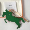 Charm. horse and jockey in two-tone green and brown leather HERMES