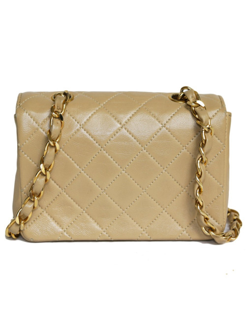 Mini quilted CHANEL bag beige