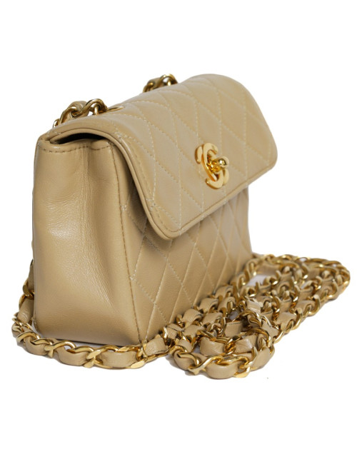 Mini quilted CHANEL bag beige