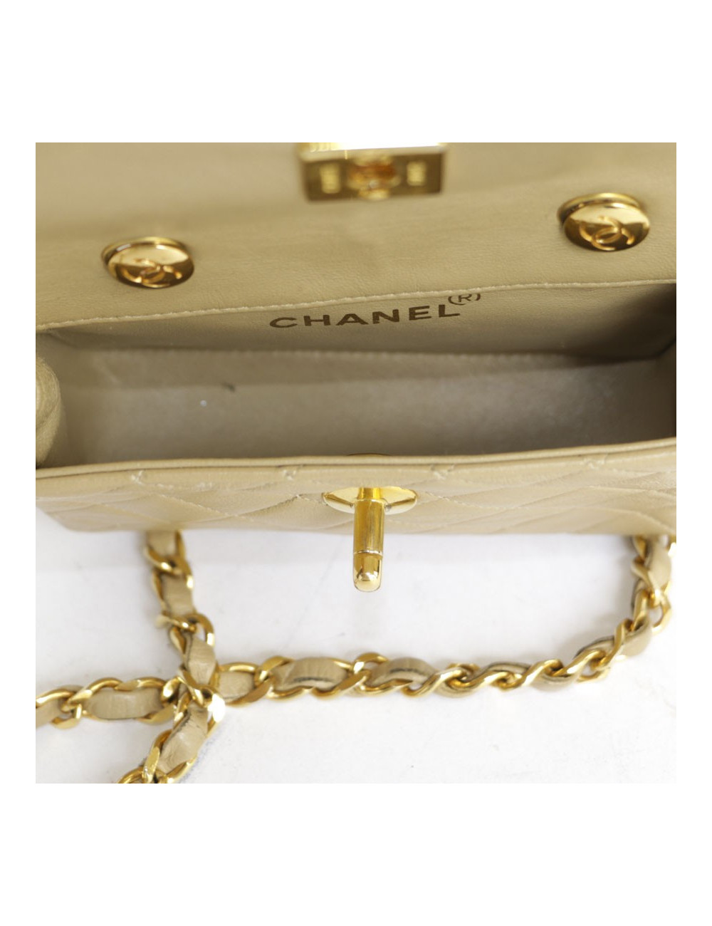 Mini quilted CHANEL bag beige