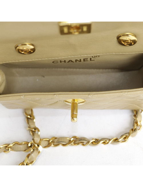 Mini quilted CHANEL bag beige