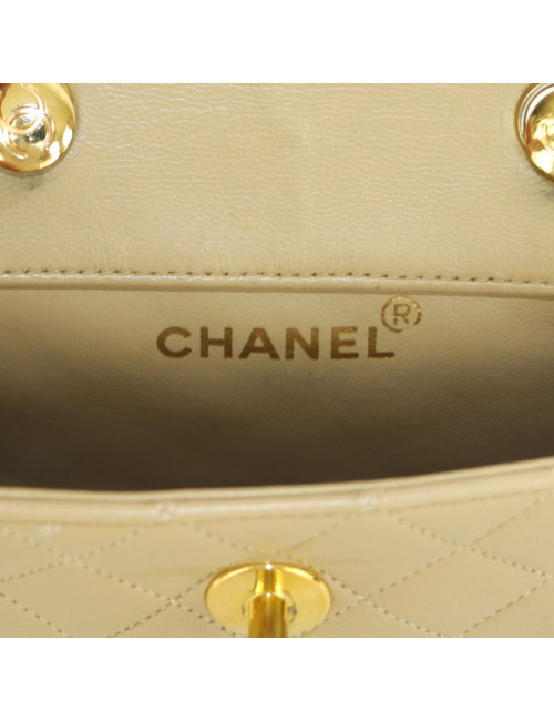 Mini quilted CHANEL bag beige