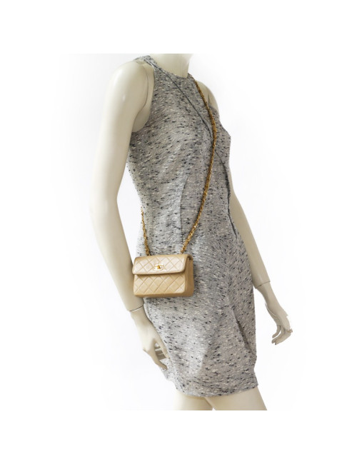 Mini quilted CHANEL bag beige