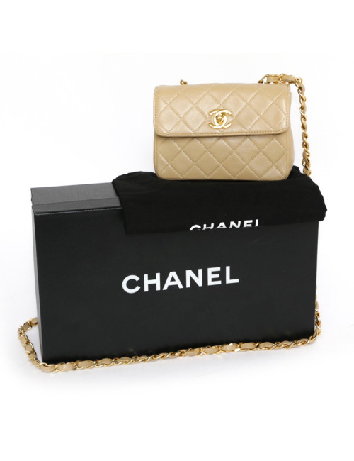 Mini quilted CHANEL bag beige