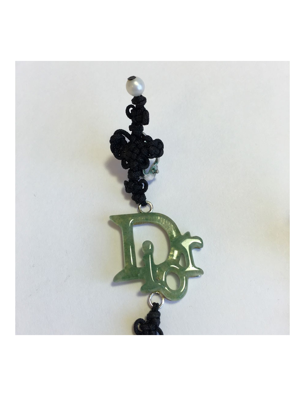 Collector DIOR clip-on earrings in fine black cord and DIOR in silver plated metal and green resin