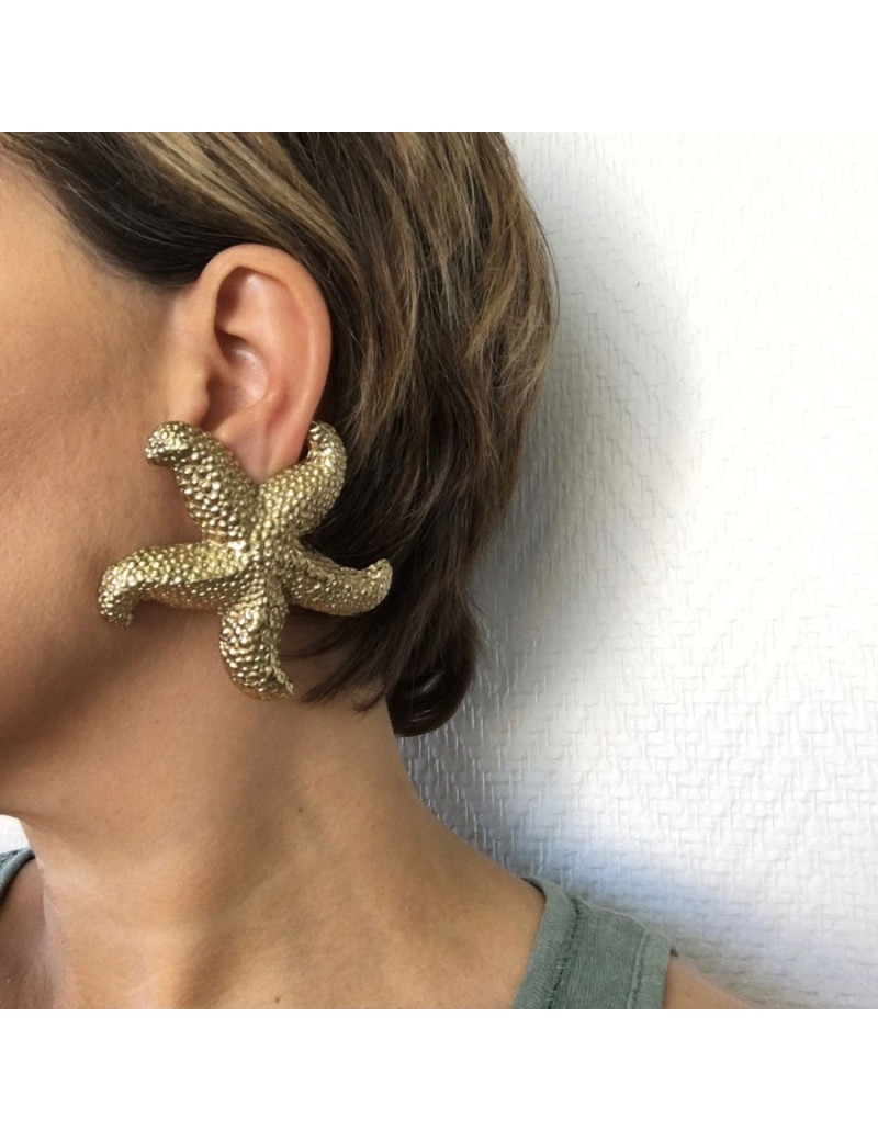 Boucles d'oreille clips YSL SAINT LAURENT étoile dorée