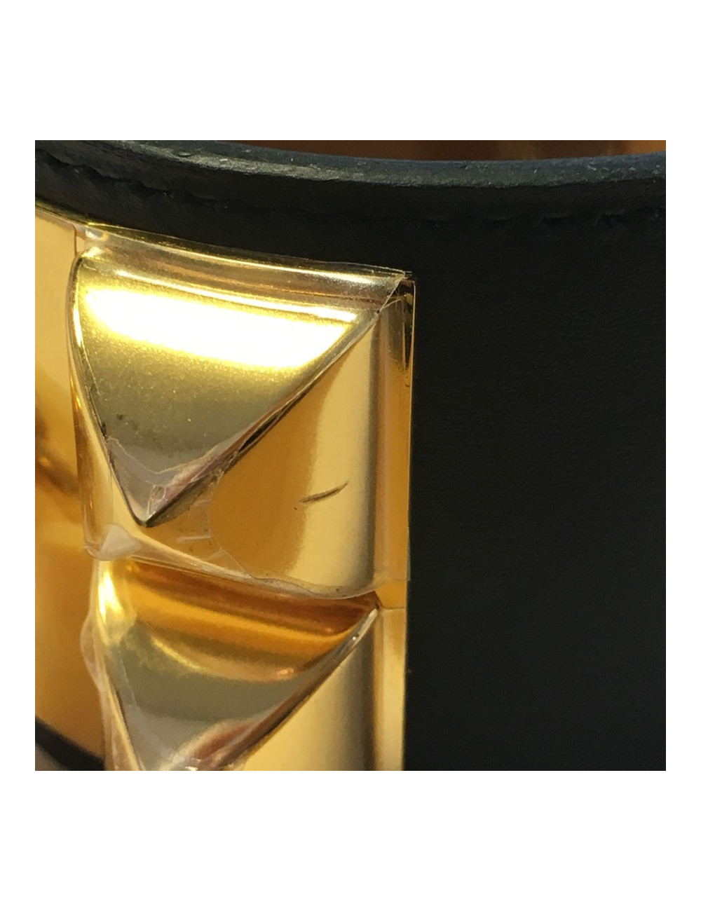 Manchette HERMES CDC en veau noir et bijouterie plaquée or