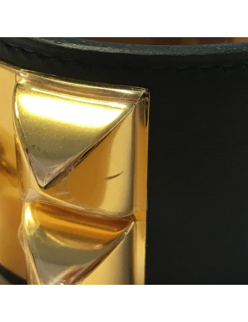 Manchette HERMES CDC en veau noir et bijouterie plaquée or