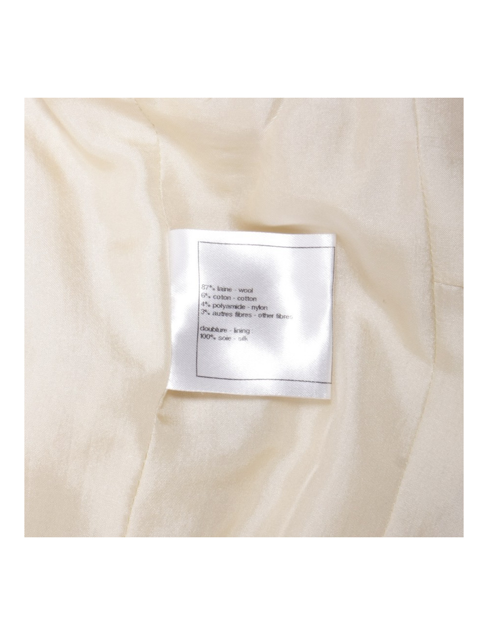 Robe CHANEL T 42 en laine crème et fils noirs