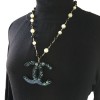 CHANEL CC pendant necklace with gilded metal, black and pearly pearls