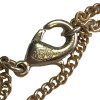 Collier CHANEL en métal doré, pendentif serti de petites perles noires