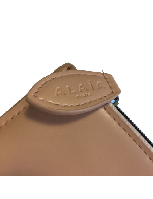 Pochette ALAIA en cuir rose poudré
