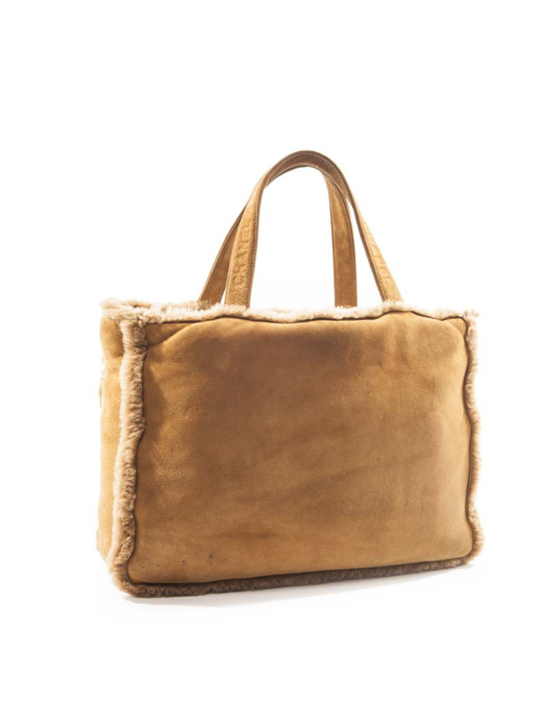 à réparer la poche Sac cabas CHANEL en peau retourné marron